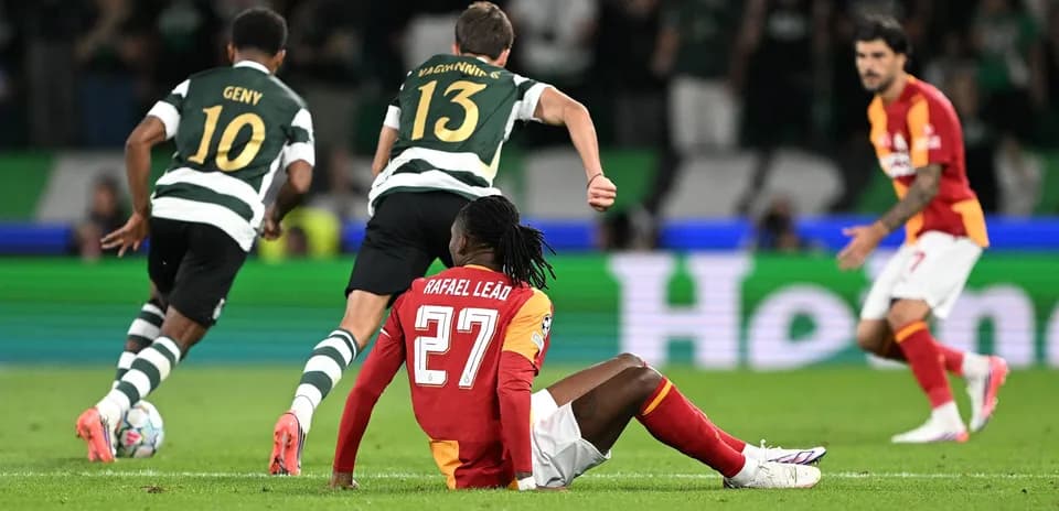 Rafael Leão sitting on the ground during match