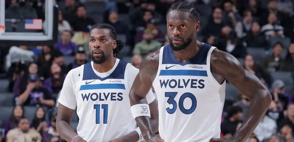 Two Minnesota Timberwolves players on the court