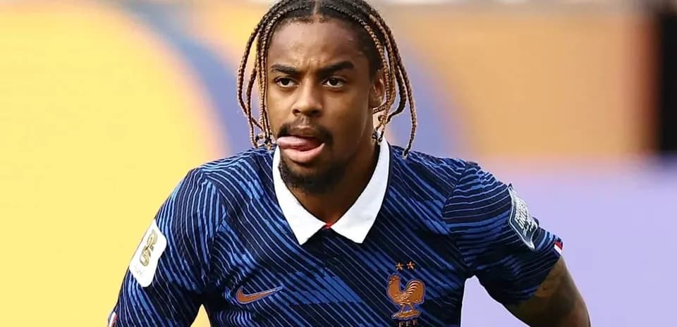 Player in blue France jersey during match action