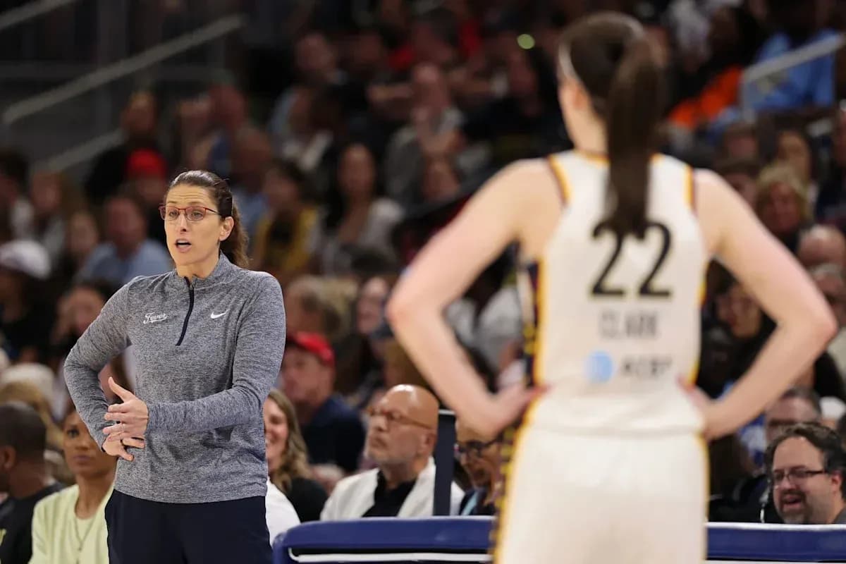 Coach giving instructions to player during game