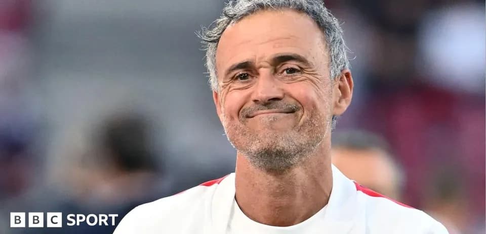 Coach smiling on the sidelines during match