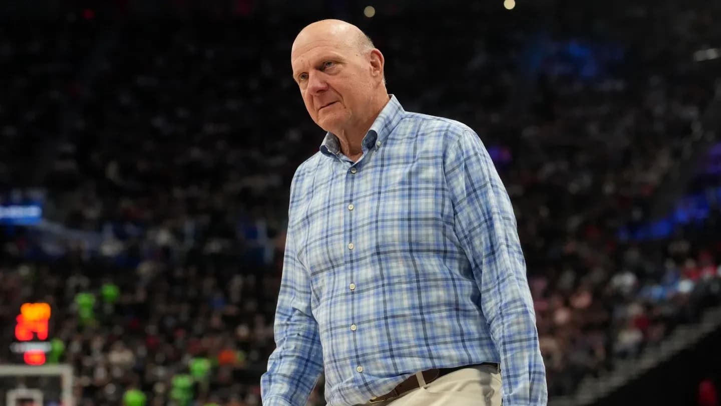 Man in checkered shirt on basketball court