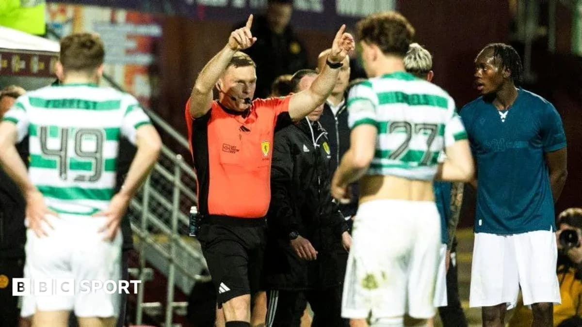 Referee issuing instructions to players during match