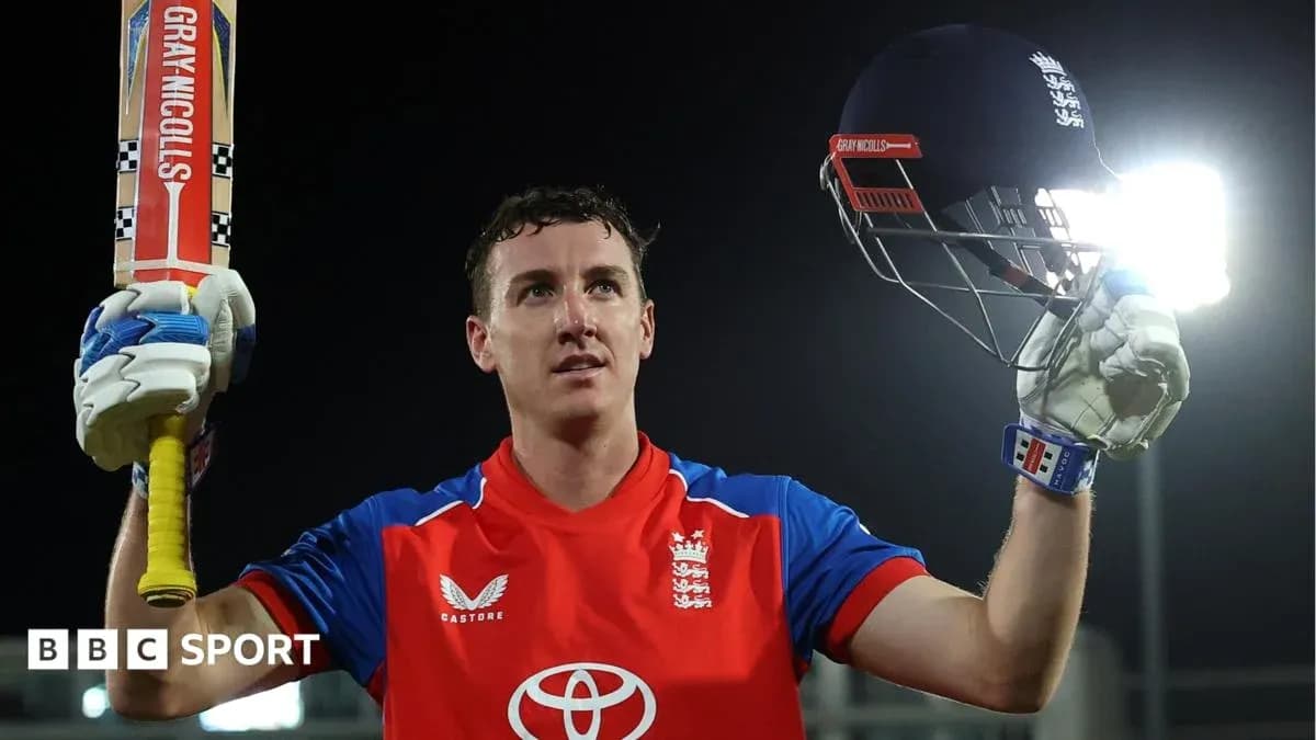 Cricketer celebrating with bat and helmet raised
