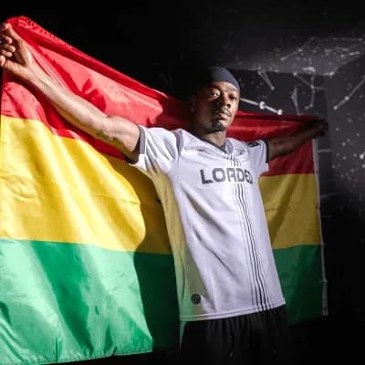 Player holding a flag during a photoshoot
