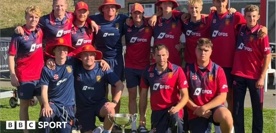 Cricket team celebrating with trophy after victory