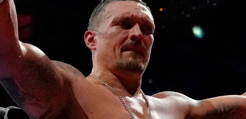 Boxer celebrating victory with arms raised