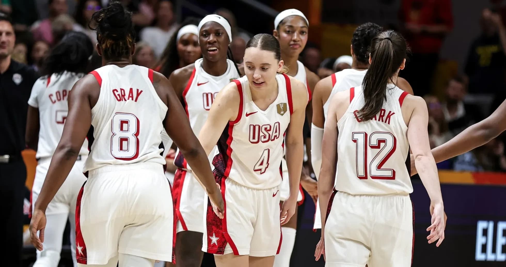 USA women's basketball team celebrating on the court