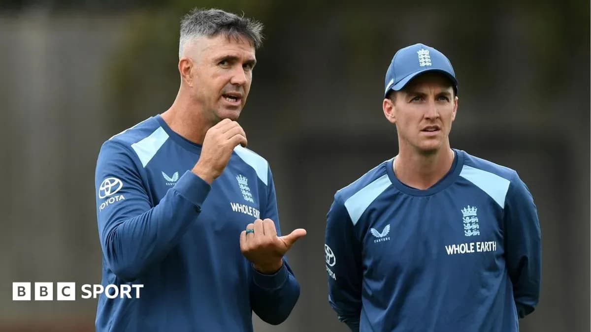 Coach discussing strategy with player during practice