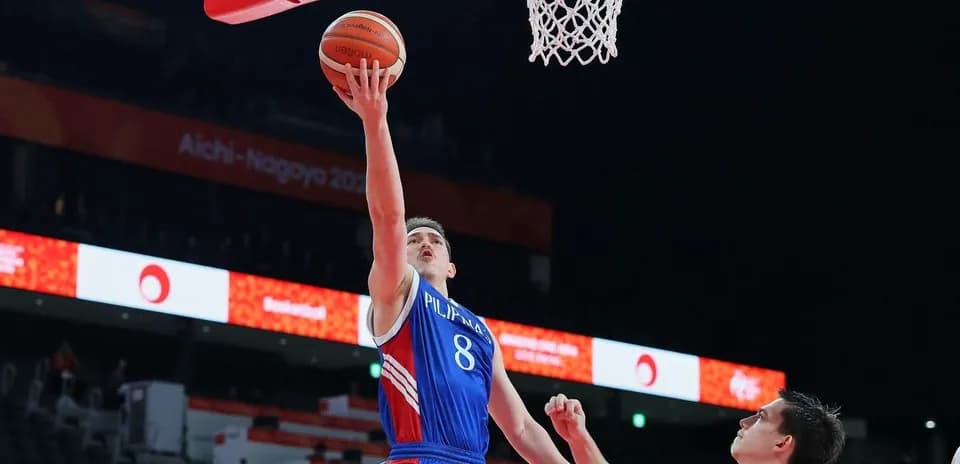 Player scoring a layup during basketball match