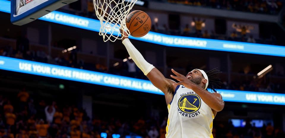Player making a layup during basketball game