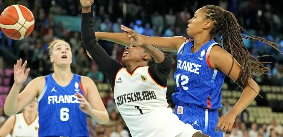 Germany and France players competing for the basketball