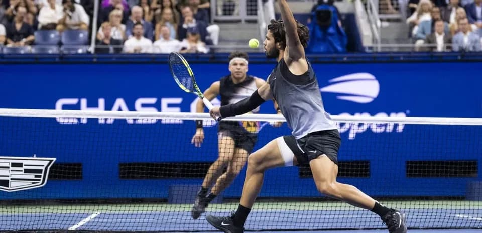 Player hitting a tennis ball during match at US Open