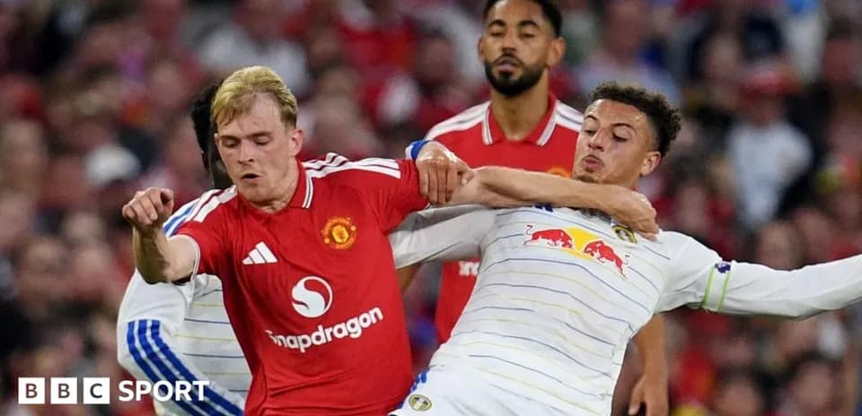 Players battling for possession during a football match
