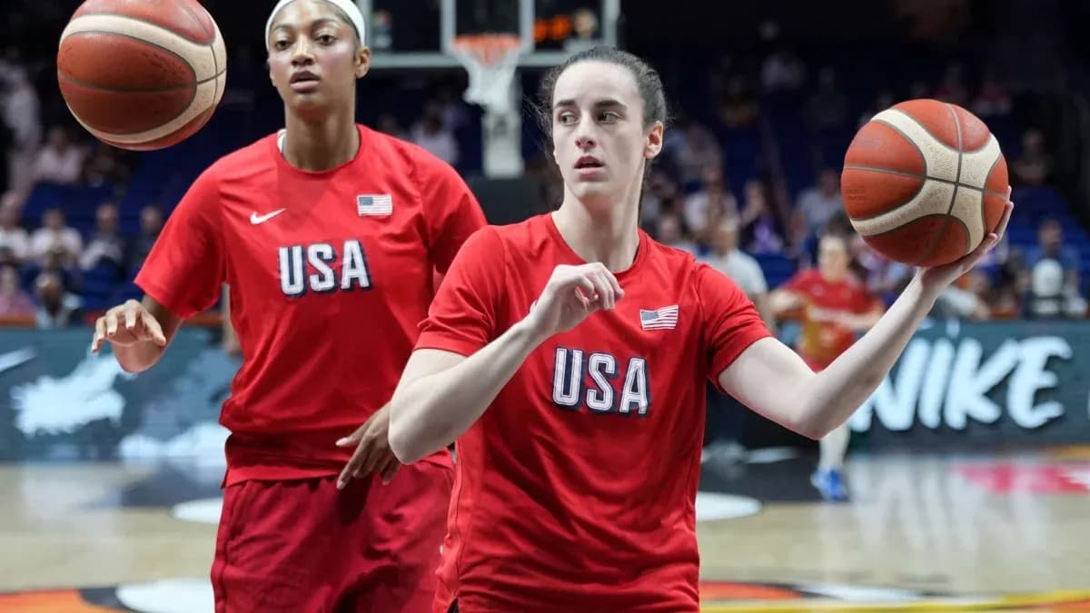 Two players warming up with basketballs before game