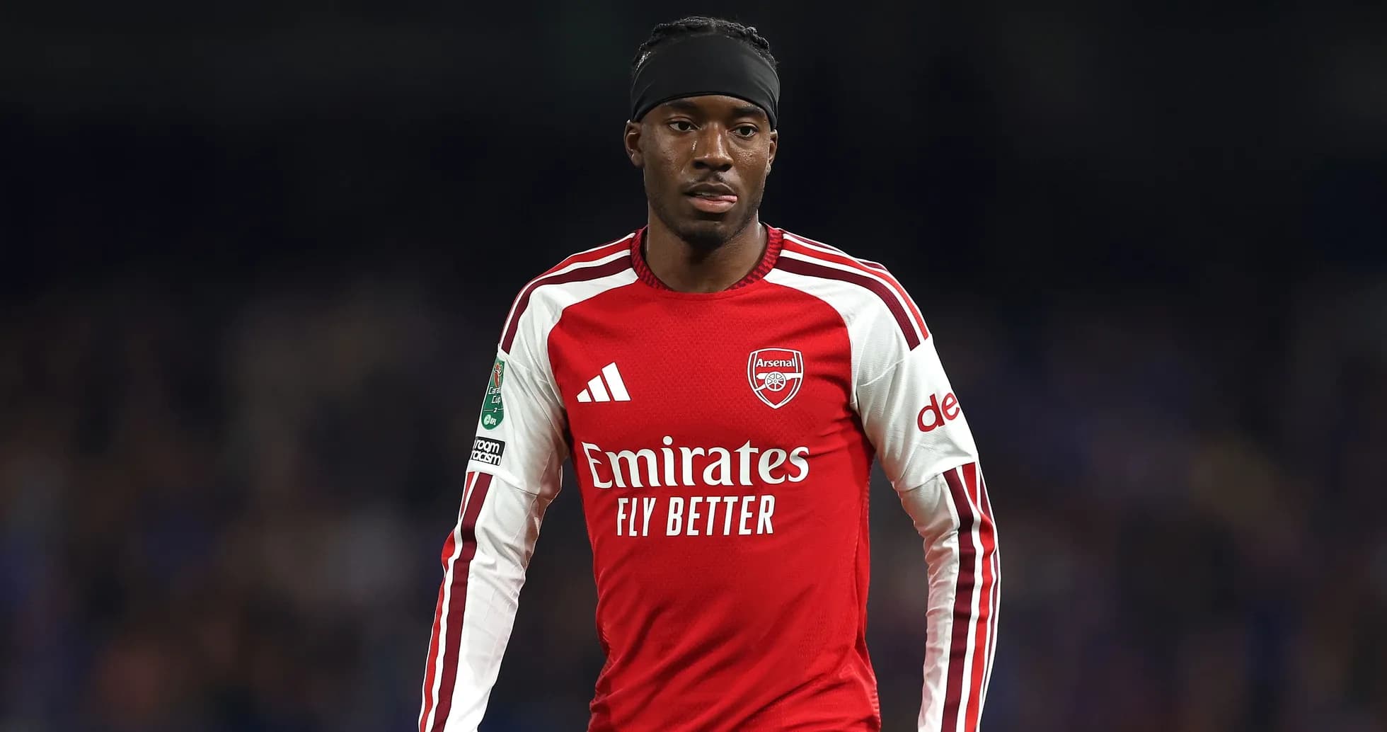 Player wearing Arsenal jersey during match