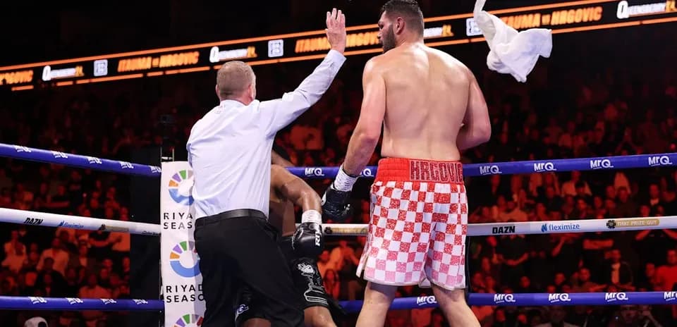 Referee stopping the fight in boxing match