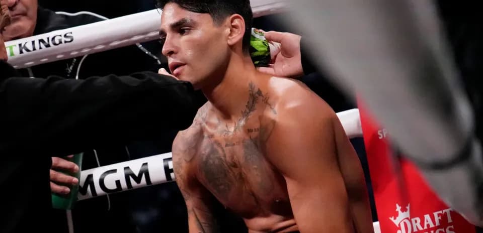Boxer receiving assistance in corner during match