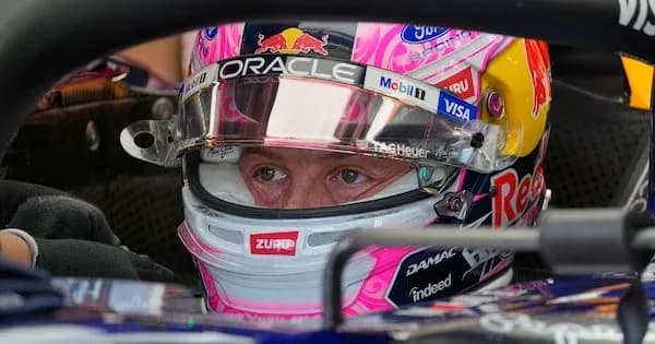 Driver focused inside Formula 1 car cockpit