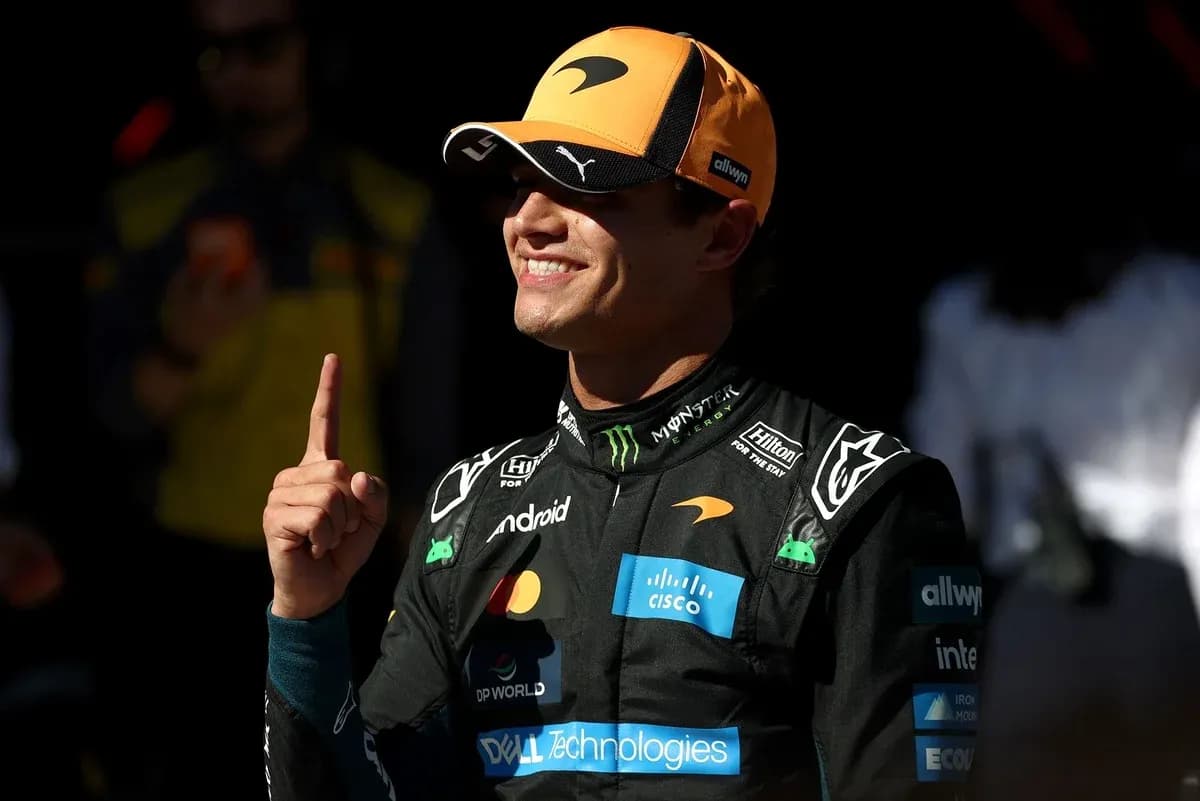Driver celebrating with finger raised in pit area Driver celebrating with finger raised in pit area