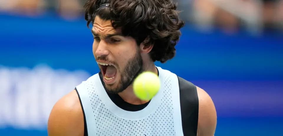 Player hitting a tennis ball during a match