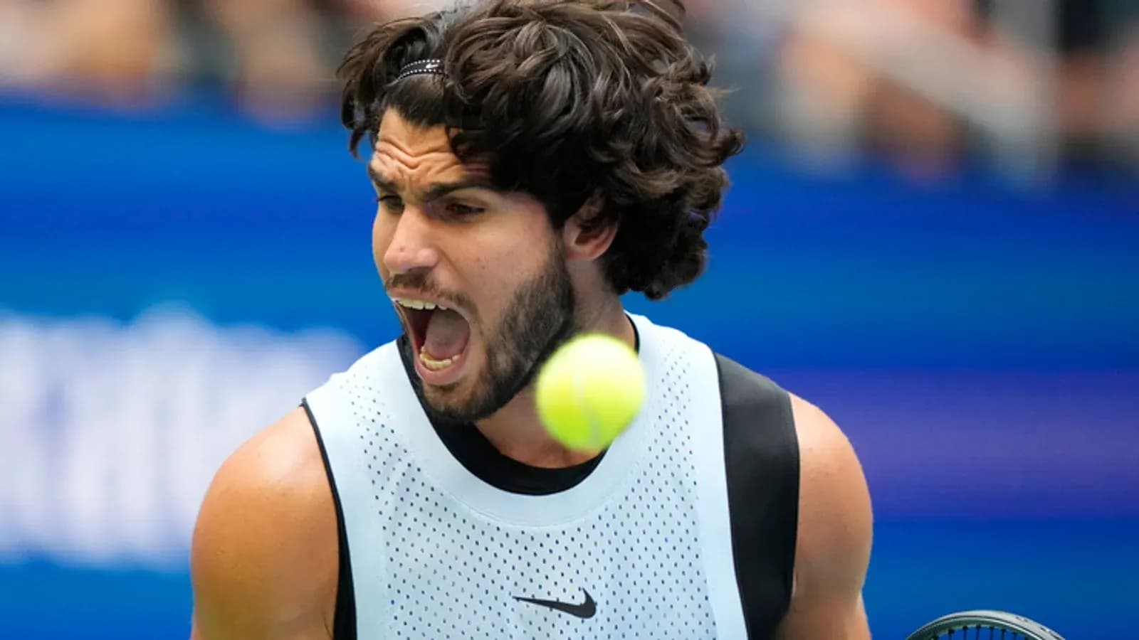 Player hitting a tennis ball during a match