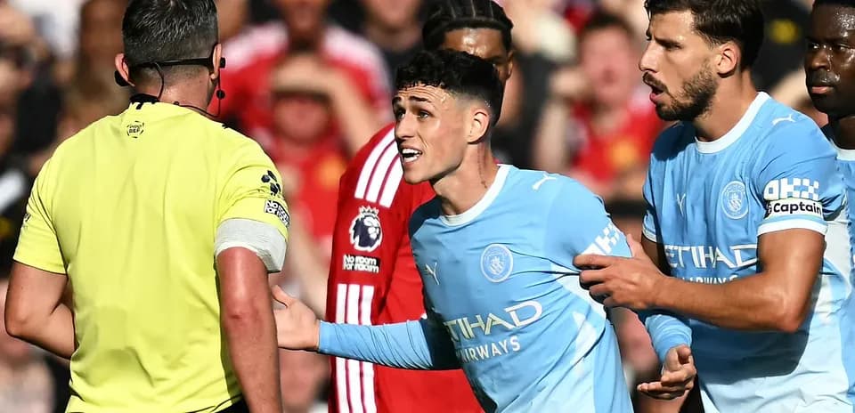 Phil Foden arguing with referee during match
