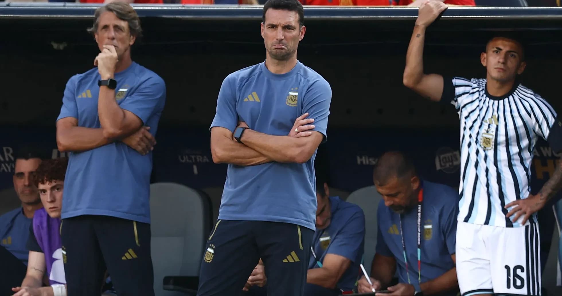 Coaches and staff observing from the bench during match