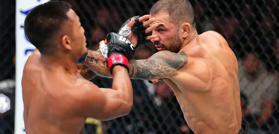 Two fighters exchanging punches inside the octagon