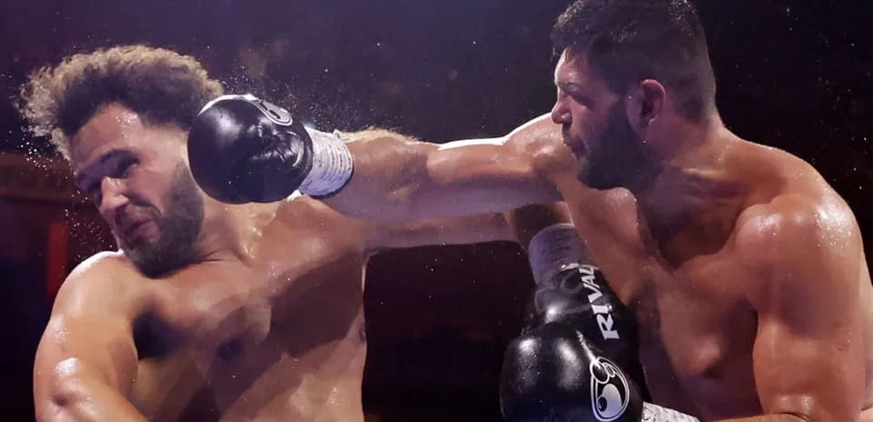 Two boxers exchanging punches in the ring