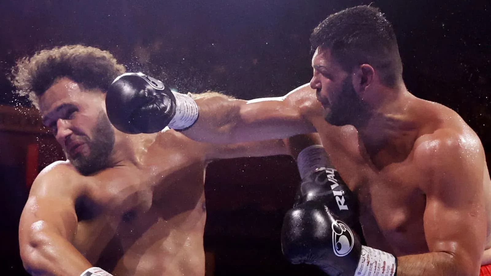 Two boxers exchanging punches in the ring