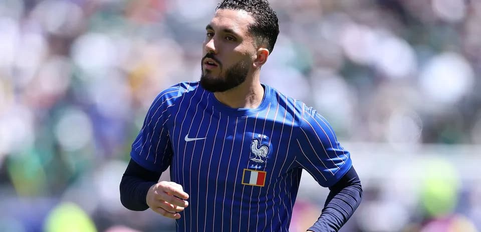 Player in France national team jersey warming up