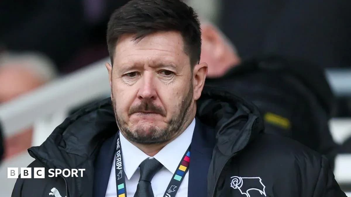 Manager in a coat at the sidelines during match Manager in a coat at the sidelines during match