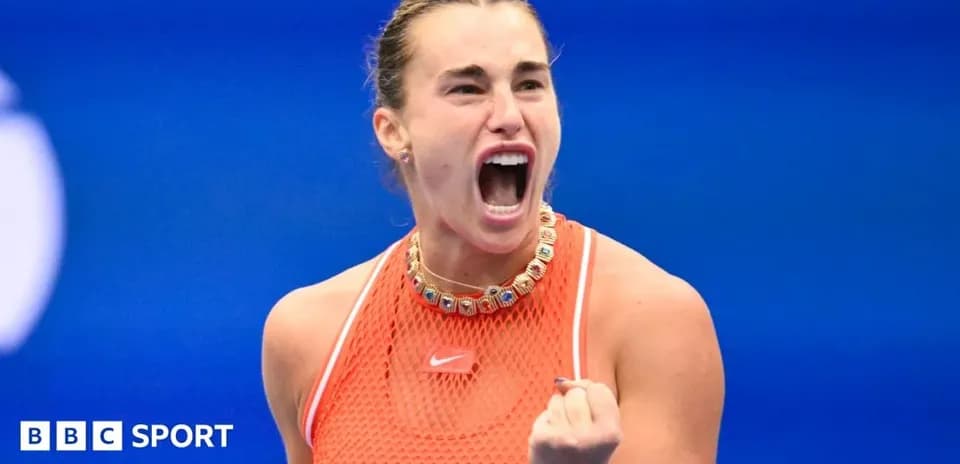 Female tennis player celebrating on the court