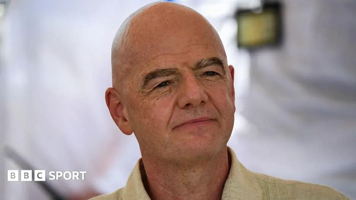 Man with bald head speaking at an event
