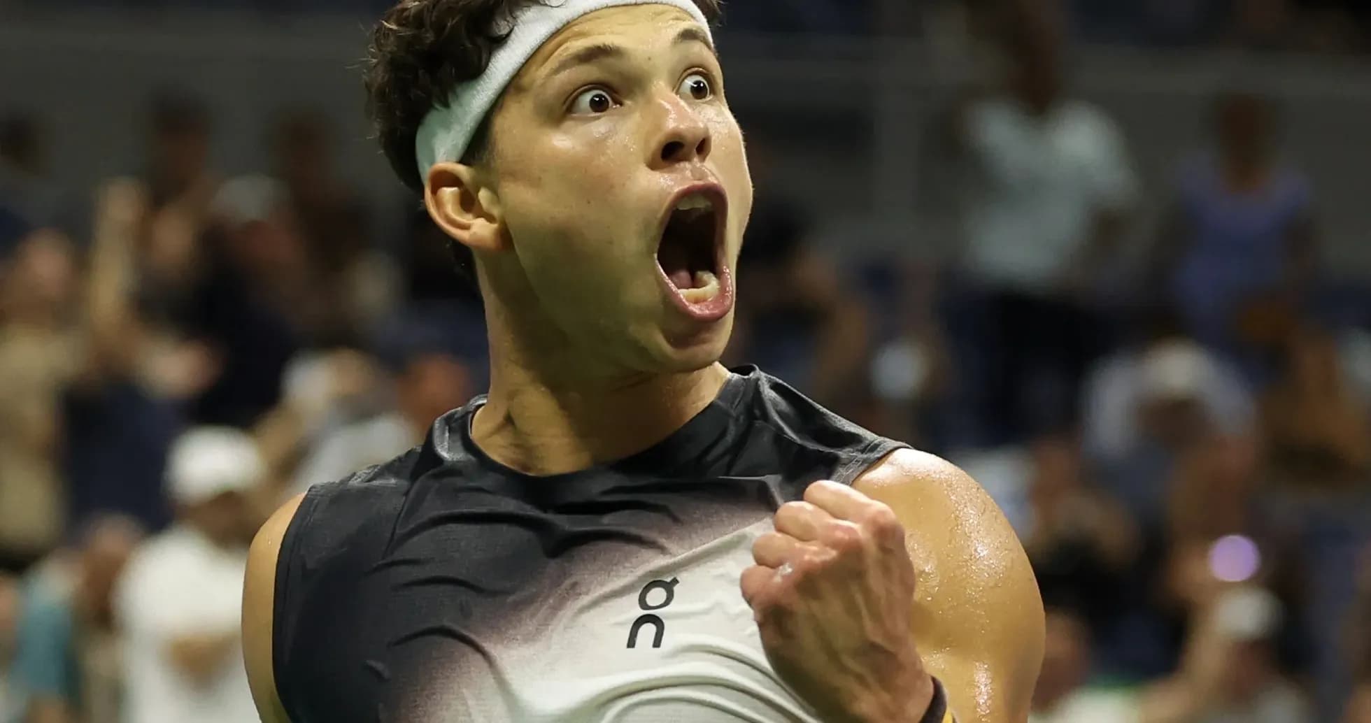 Tennis player celebrating a victory on court