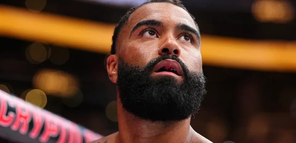 Boxer with a beard looking up during match