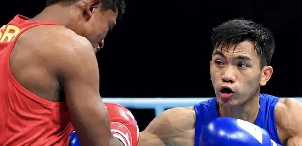 Two boxers exchanging punches in the ring