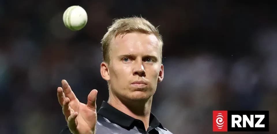Cricket player preparing to bowl a ball