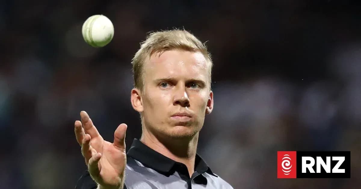 Cricket player preparing to bowl a ball