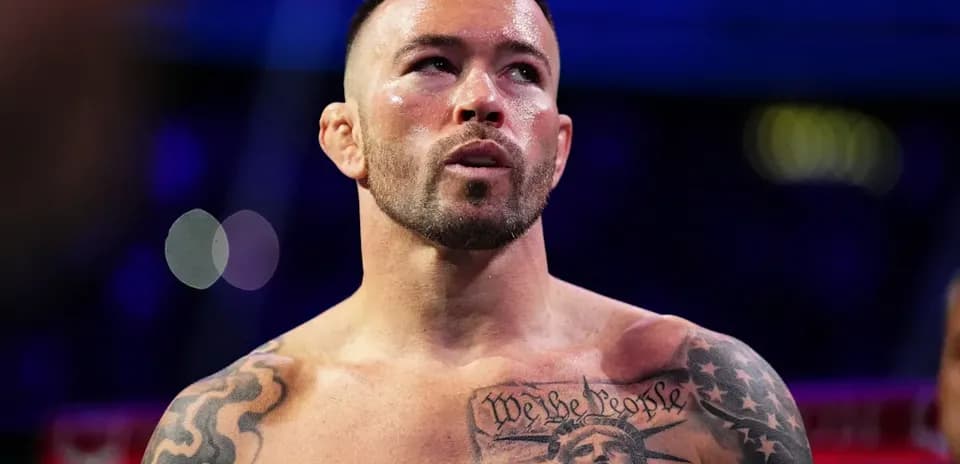 Boxer with tattoos preparing for match