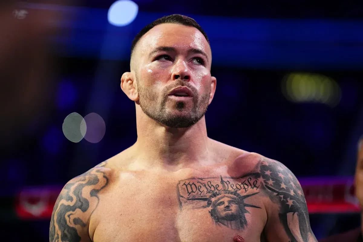Boxer with tattoos preparing for match Boxer with tattoos preparing for match