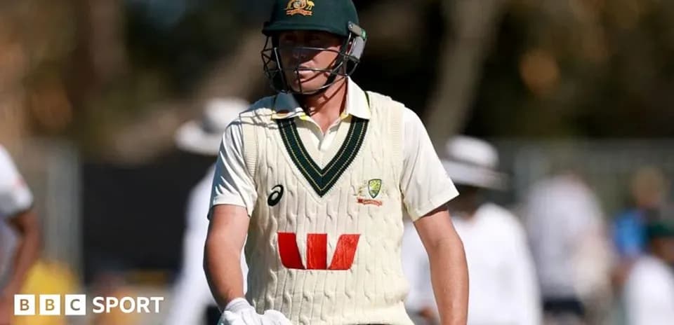 Cricketer wearing Australia kit walking on field