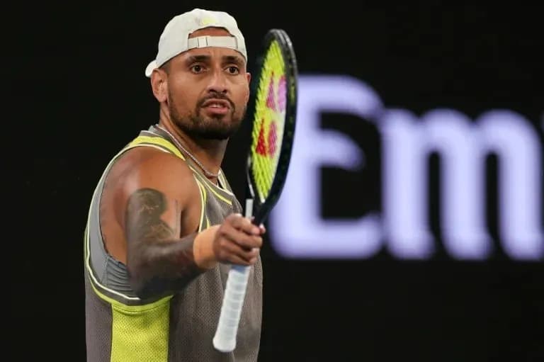 Tennis player holding racket during match