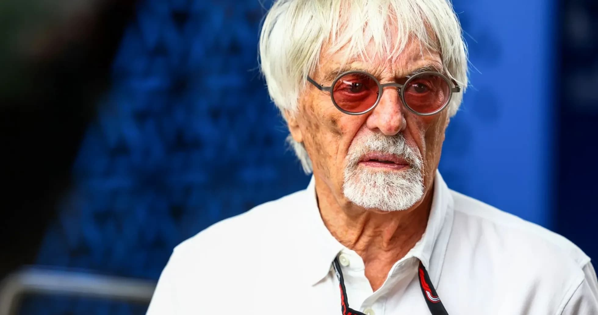 Older man with white hair and sunglasses