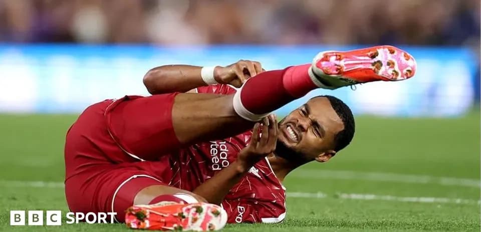Player on the ground holding injured leg