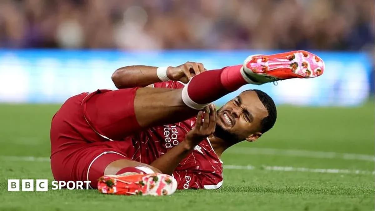 Player on the ground holding injured leg