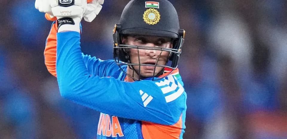 Batsman preparing to strike during cricket match