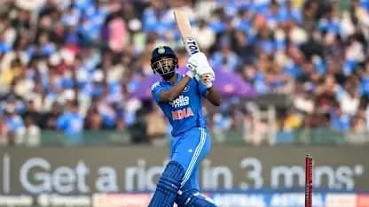 Batter playing a shot during cricket match