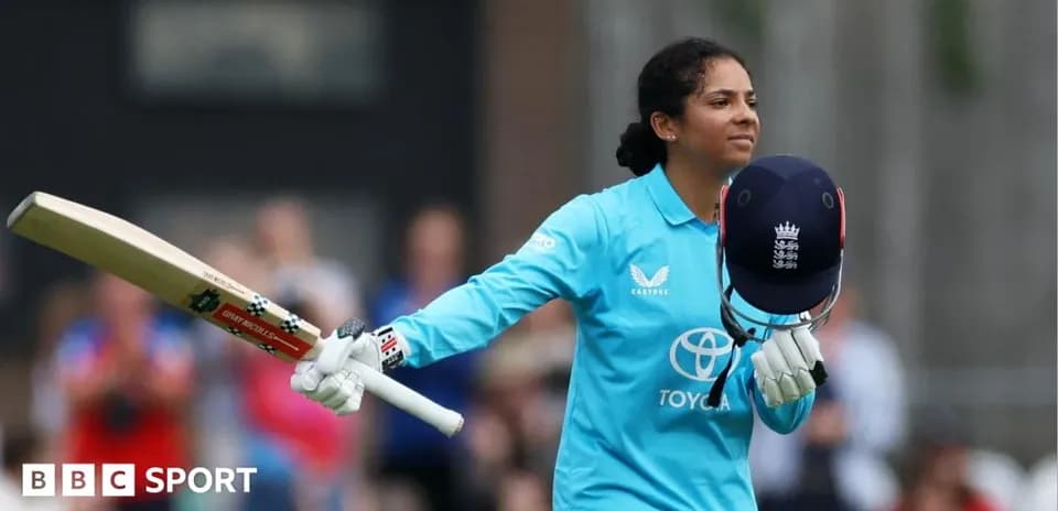 Cricketer celebrating after scoring runs with bat